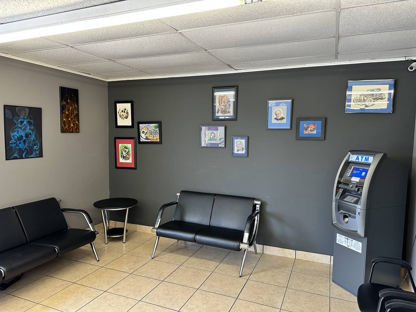Waiting room at Big Daddy's Tattoos OKC with comfortable seating for clients